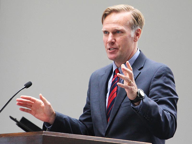 Reverend Dr. Jon D. Payne speaking at a conference
